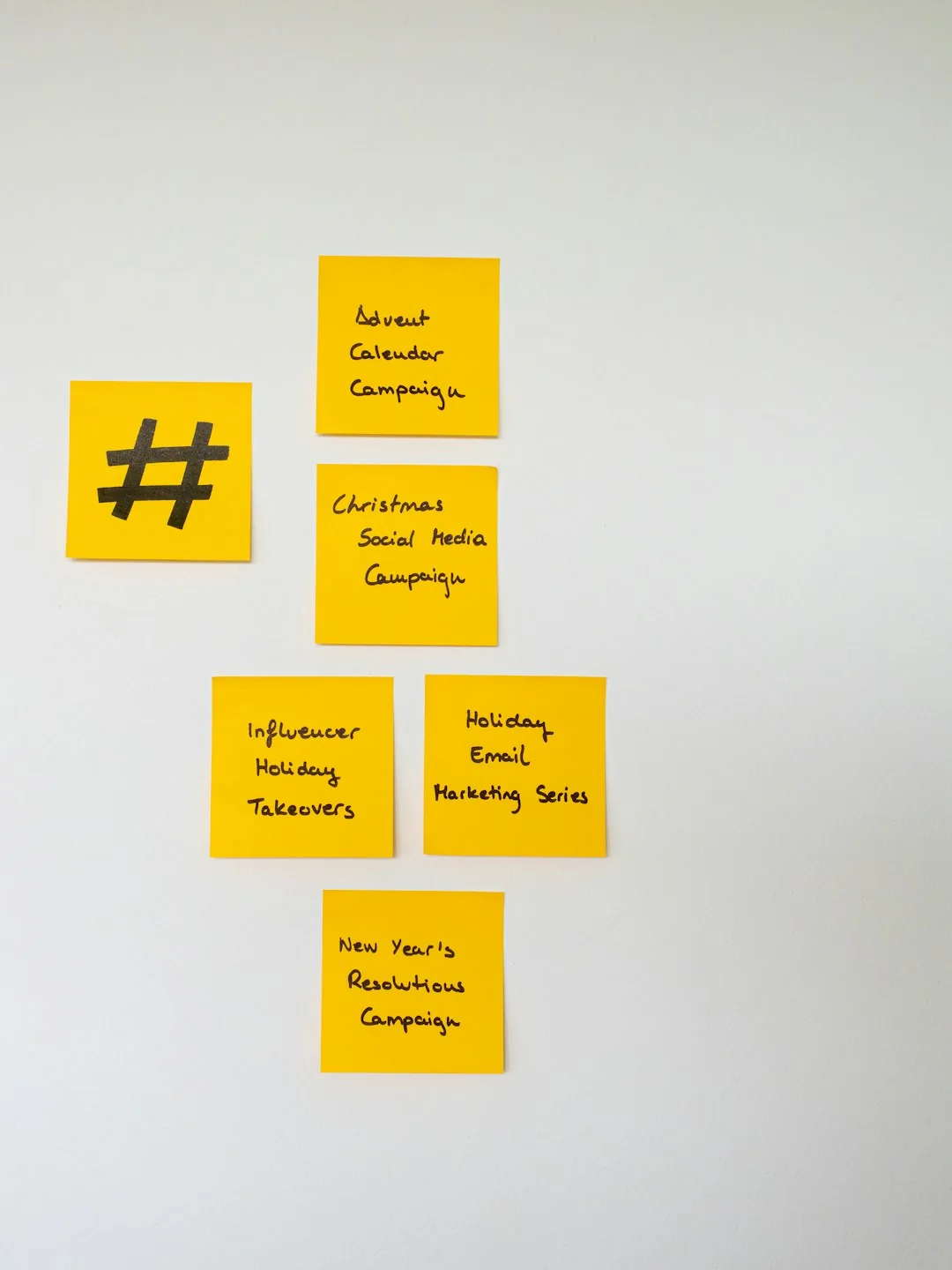 Flat lay of employer branding materials on an office table, showcasing marketing and design.